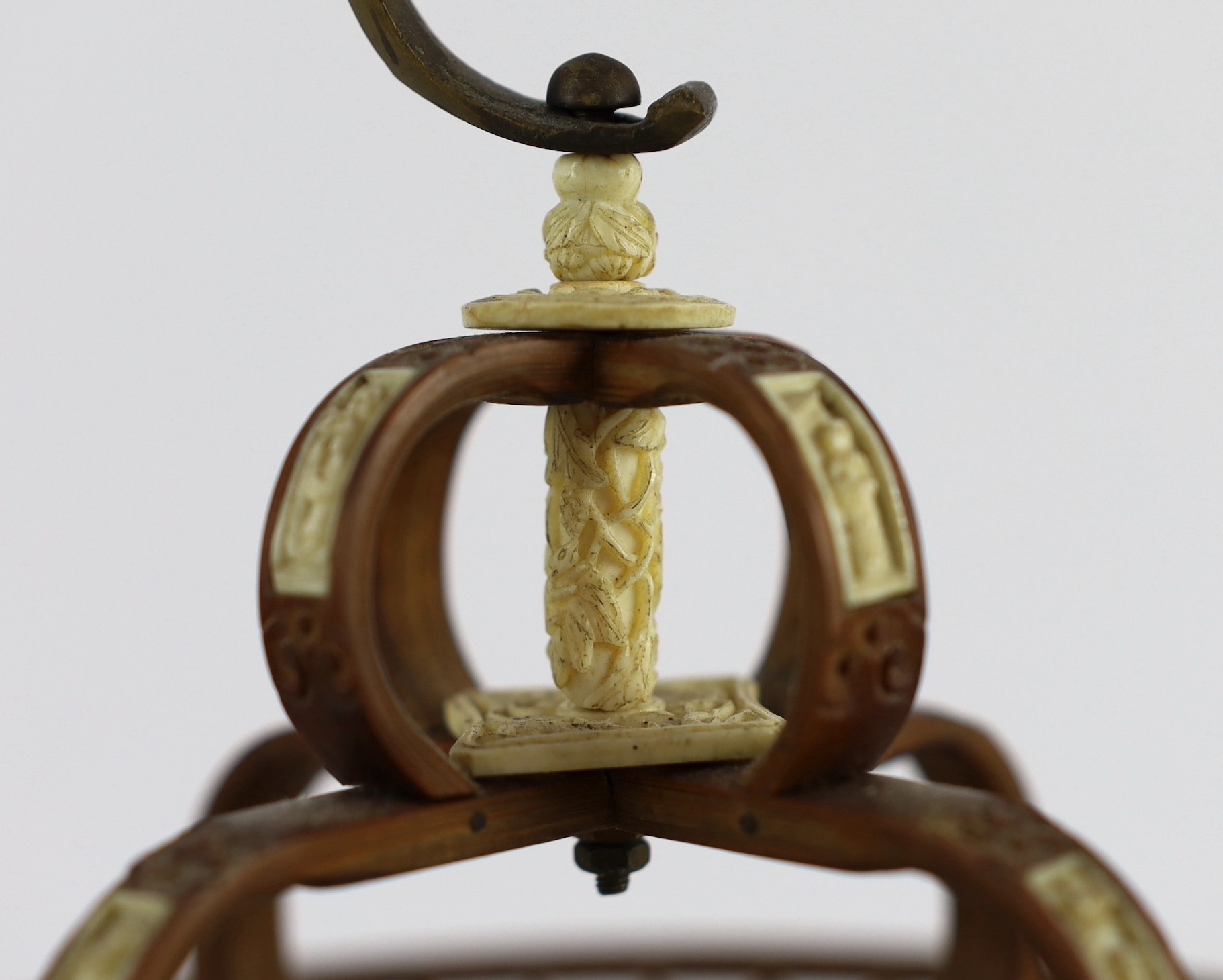 A Chinese bamboo and Guangzhou ivory mounted bird cage, late Qing dynasty, with two Guangxu mark and period porcelain bird feeders (1875-1908), cage 32.5cm high to top of handle